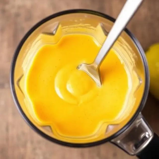 Mango Lassi being blended to a creamy consistency